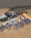 Front view of Klein Tools metal folding duct-bending tool, 18×3 in, with blue-handled pliers and scissors.