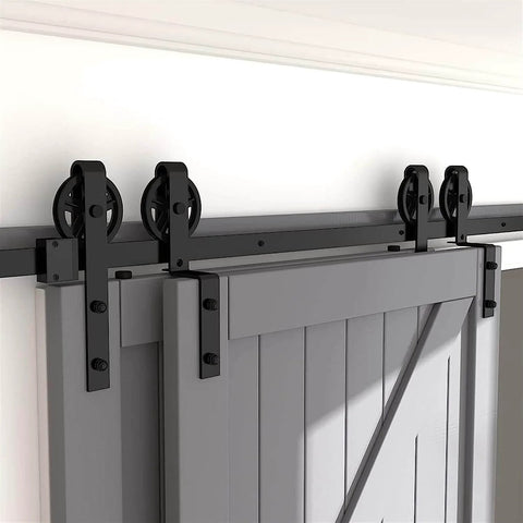 Hard Wearing Sliding Barn Door Track Hardware Kit For Tight Spaces Black Powder Coated 6mm Carbon Steel With Ultra Quiet Rollers And Bypass Option, Library Ladder Style, Fits Single Or Double Wooden Doors In Low Ceiling Areas installed on a grey door.