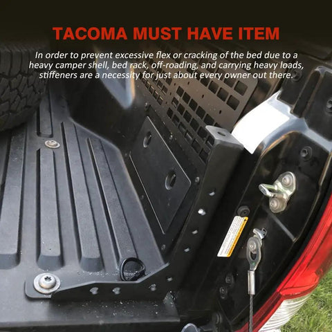 Badass Heavy Duty Tacoma Bed Channel Stiffener And Rear Support Bracket For 2005 To 2022 Toyota Pickup installed in Tacoma bed, showing sturdy black steel frame.