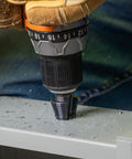Drilling metal with Step Drill Bit With Aluminum Titanium Nitride Coating For Long Lasting Durability, double fluted design visible.