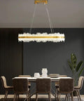 Chic Round Gold LED Pendant Light With Cut Diamond Glass Shade Dimmable Hanging Lamp For Modern Spaces Top Tier Smooth Glow, illuminating dining space.