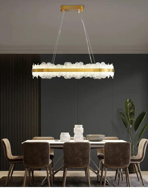 Chic Round Gold LED Pendant Light With Cut Diamond Glass Shade Dimmable Hanging Lamp For Modern Spaces Top Tier Smooth Glow, illuminating dining space.