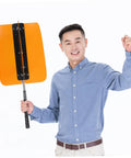 Smiling person holding a Golf Swing Power Fan Trainer With Adjustable Wind Resistance For Indoor Outdoor Practice, yellow model.