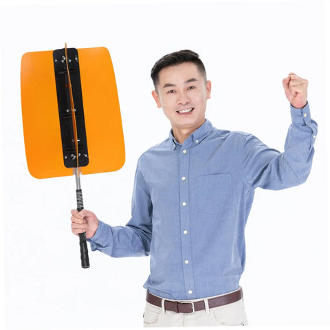 Smiling person holding a Golf Swing Power Fan Trainer With Adjustable Wind Resistance For Indoor Outdoor Practice, yellow model.