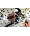 Close-up of hands using Bike Disc Rotor Truing Fork Tool For Mountain And Road Bikes with Comfortable Handle on rotor.