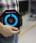 Person holding Safety Tags By The Roll Caution Barricade OSHA Compliant Waterproof PF Cardstock Tear Resistant Six And A Quarter Inch Dispenser Included Tar 160 American Made Signs And Labels For Work Sites
