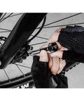 Person using Torq Stick Pro 4-20 Nm Torque Wrench Kit With Mini Ratchet Tool on a bicycle wheel hub