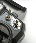Close-up of FPV Racing Drone Radio Transmitter Built For 2.4G AFHDS 2A 10CH showing switches and control dials.