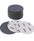 20 Pieces Of 75mm Wet Dry Hook And Loop Sanding Discs Made With Silicon Carbide For Multi-Purpose Polishing Work In Various Grit Grades stacked and laid out.