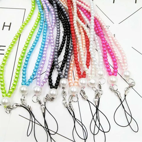 Colorful beaded lanyards with clasp ends, arranged neatly, showcasing various vibrant beads with attached black loops.