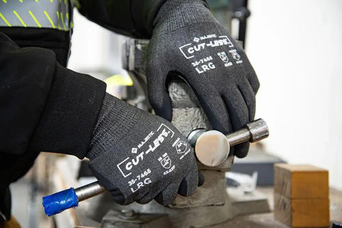 Cut-Less Korplex Glove With Foam Nitrile Palm For Cut Resistance And Dexterity Touch Screen Compatible, large size, in use.