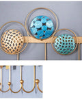 Heavy Duty Wrought Iron Wall Decor With A Dope Partition Rack And Coat Hook This Hand Painted Blue Gold Storage Organizer detail of decorative hooks and round shelves.