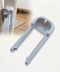 Lock Down Your Nursery With These Heavy Duty Baby Gate Clips That Keep Pressure Mounted Barriers Solid For Active Kids And Puppies No Sweat Quick Install Extra Safety Latch Two Pack - white polypropylene clip attached to a door.