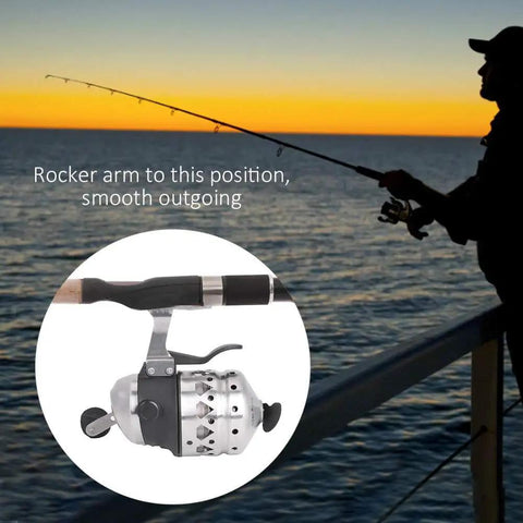 Close-up of Ambidextrous Spincast Fishing Reel With Stainless Steel Build, mounted on rod near sunset-lit ocean