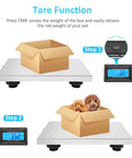 Commercial Grade Digital Shipping Scale With Wireless Display And Bullyproof Stainless Steel Platform 992 Lb Heavy Duty Postal Scale showcasing tare mode with a box and pets.
