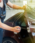 Mechanic using Go-To Dual Force Multi-Purpose Lubricant And Penetrant Aerosol on car door hinge, 14 oz can, low odor formula.