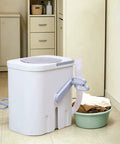 Hand Crank Washing Machine With Biomimetic Scrub Interior Manual Portable Laundry Soaker in a kitchen setting with clothes nearby.