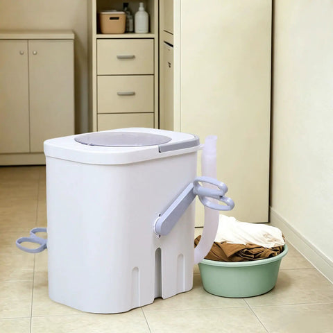 Hand Crank Washing Machine With Biomimetic Scrub Interior Manual Portable Laundry Soaker in a kitchen setting with clothes nearby.