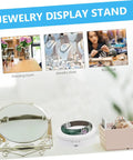 White Electric Rotating Display Stand For Jewelry Watches And Cosmetics Automatic Turntable Showcase with jewelry and mirror in boutique setting.