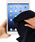 Extra-large black microfiber cleaning cloth (12x12 in) cleaning a tablet screen