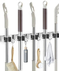 Stainless Steel Wall Mounted Broom And Mop Holder With Five Racks And Four Hooks; organizing brooms, mops, and brushes.