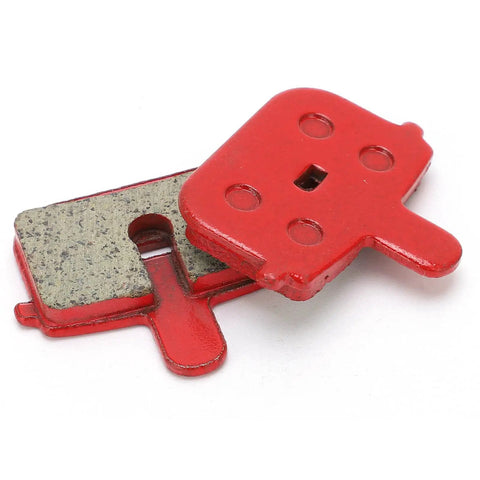 Red brake pads from Eight Pack SemiMetallic Disc Brake Pads for Mountain And Electric Bikes, high heat resistant, angled view.