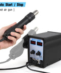Person holding 2 In 1 SMD Hot Air Rework Station With Digital Soldering Iron And Heat Gun Includes 5 Solder Tips Kit