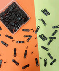 Picture frame turn button fasteners, 100 black metal pieces with screws, top view