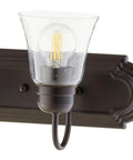 Transitional Five Light Vanity Fixture in Oiled Bronze with Clear and Seeded Glass Damp Rated Bathroom Lighting close-up view