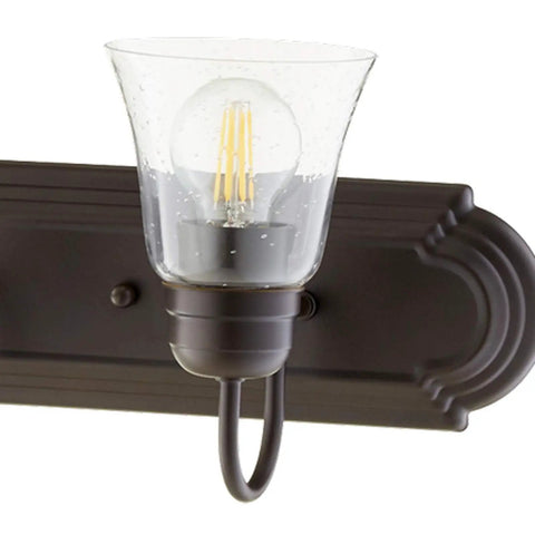 Transitional Five Light Vanity Fixture in Oiled Bronze with Clear and Seeded Glass Damp Rated Bathroom Lighting close-up view