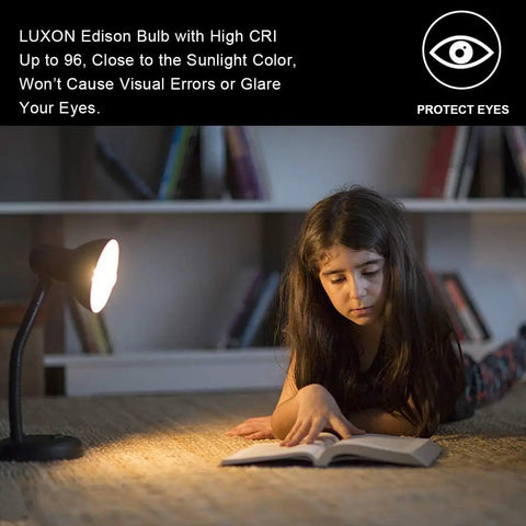 Girl reading under warm light, showcasing Vintage Edison Bulbs 60W Amber Warm Dimmable Incandescent E26 Base For Wall Sconce.