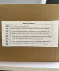 Safety warning label on a cardboard box with multilingual fire safety instructions for the Top Tier 3D Printer Filament Dryer Box.