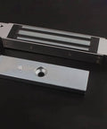 Flush Mount Magnetic Lock 350Lb 180Kg Beefy Holding Power for Access Control on a Single Door 12V Electromagnetic Lock Fail Safe Built In Surge Suppressor Steel Alloy, showing components on black background.