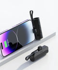 No Sweat Battery Charging Case For Rechargeable Cells Solderless DIY Power Bank Housing next to a smartphone with a charging screen.