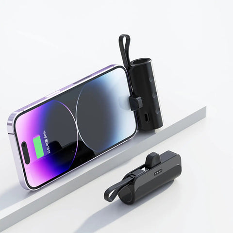 No Sweat Battery Charging Case For Rechargeable Cells Solderless DIY Power Bank Housing next to a smartphone with a charging screen.