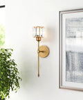 Brushed brass wall sconce with fabric shade for bedroom, gold finish, modern rustic ambience, hardwired vanity light