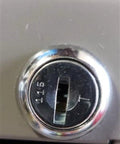 Close-up of a locking mechanism on office furniture, showing the Custom Cut File Cabinet And Cubicle Desk Replacement Key functionality.