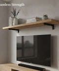 Living room setup with TV, wooden shelf, and Hidden Mount Floating Shelf Bracket For Living Room And Office in matte black