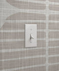 Super Sleek Geometric Stripe Vinyl Wallpaper Shows Off Subtle Leather Texture And Delivers Knockout Durability For Heavy Traffic Commercial Spots Or Wild Home Rebounds Featuring Type Ii Sturdiness And Custom Prints That Bring The Real Deal Vibes on a light beige wall with a white light switch.
