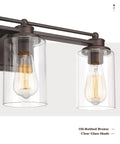 Close-up of Industrial 3 Light Vanity Light Fixture For Bathroom Over Mirror In Oil Rubbed Bronze Finish with clear glass shades.