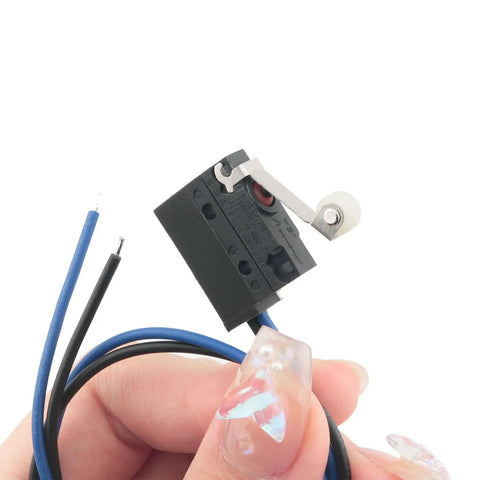 Black Waterproof Micro Switch With Roller Lever IP67 Sealed Limit Switch For Rugged Environments held in hand