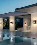 Slick Black Outdoor LED Wall Light Cylinder Sconce With Dual Up Down Lighting 120V 10W Warm Dimmable Waterproof on modern patio wall