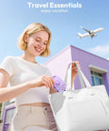 Person placing Purple Travel Power Strip With Four Outlets And Three USB Ports Including USB C into a white bag outdoors.