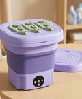 No Hustle Foldable Washing Machine With Three Deep Clean Settings And Super Chill Spin Dry For Socks Clothes Towels And Delicates Portable Half Automatic Mini Washer on a table.