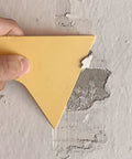 Quick Dry Wall Patch Kit for Holes and Cracks Easy Wall Filler Paste applied with scraper on damaged wall surface