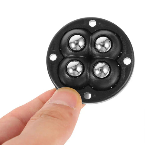 Close-up of black ABS mini swivel caster wheel from 6 Pack Stick-On Adhesive Mini Swivel Caster Wheels For Furniture And Appliances.