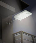46 LED Solar Outdoor Lights With Mounting Pole 4 Modes Motion Sensor Wall Light illuminating a patio at night.