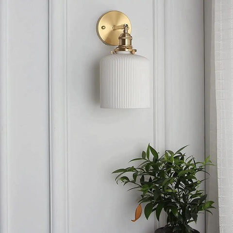 Wall Lamp, Nordic Minimalist Bedroom Light, Brass Ceramic Retro Lamps, wall-mounted fixture beside green plant.