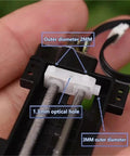 Close-up of a heavy duty linear actuator part showing details, dimensions, and optical hole, used in DIY automation projects.