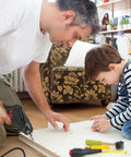 Man and child assembling furniture with Flexible Drill Bit Extension Set All In One 19 Pieces